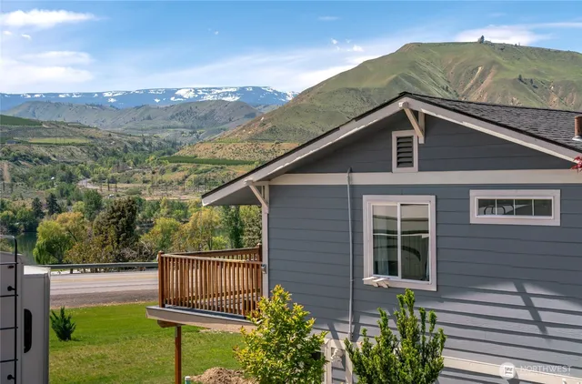 a view of a house with wooden fence and floor