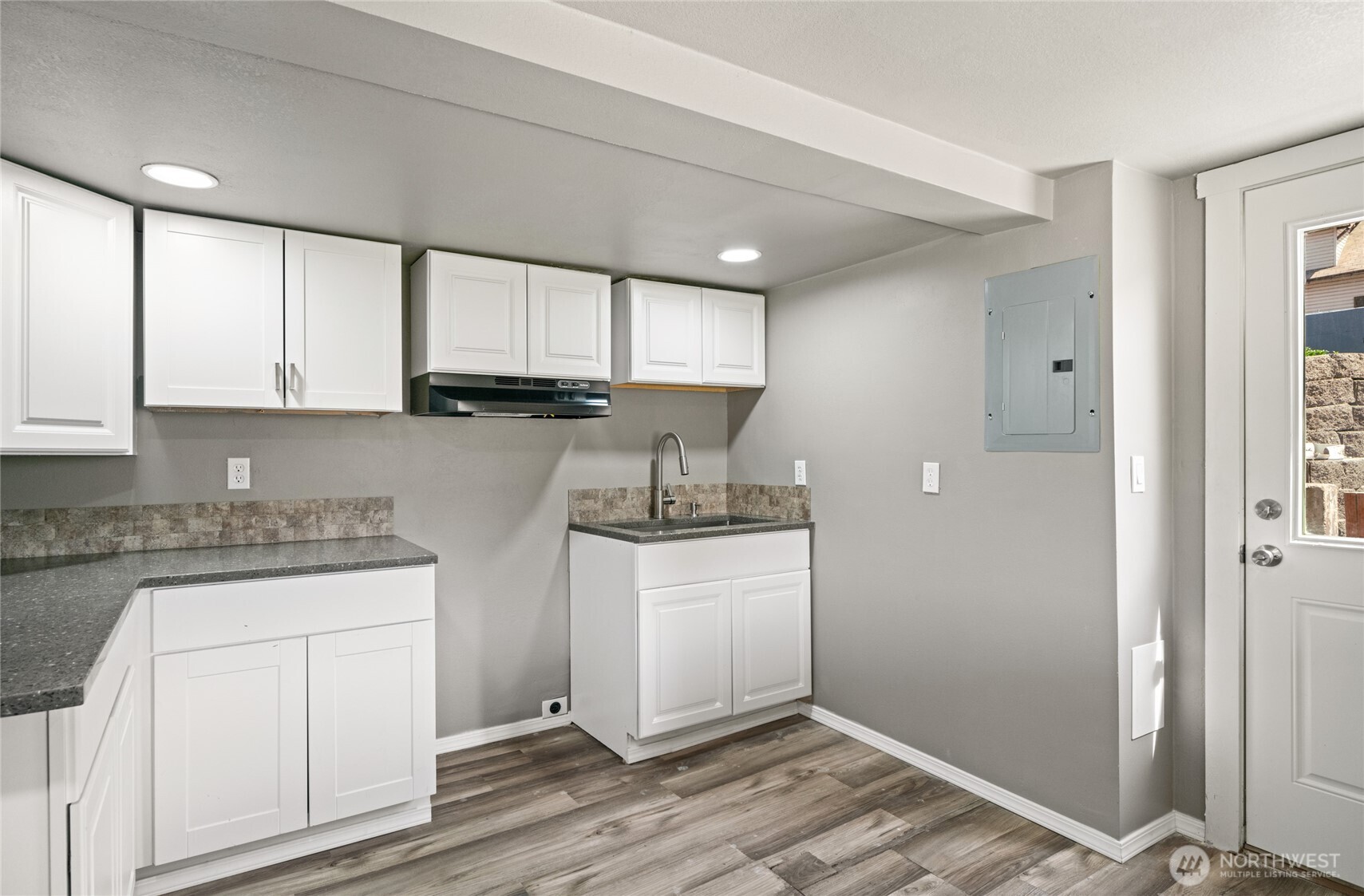 2440 Rock Island Road East Wenatchee, WA 98802 - Photo 27 of 37 a kitchen with stainless steel appliances granite countertop a sink stove and cabinets