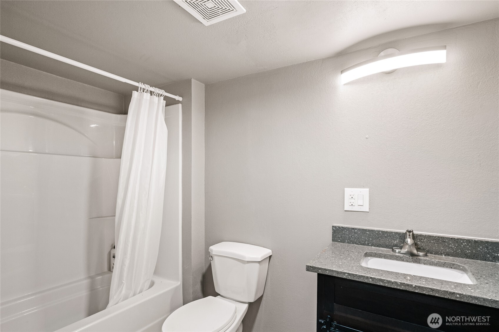 2440 Rock Island Road East Wenatchee, WA 98802 - Photo 30 of 37 a bathroom with a sink toilet a mirror and shower