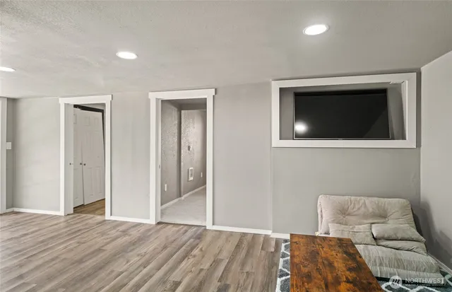 a bedroom with a bed and a television