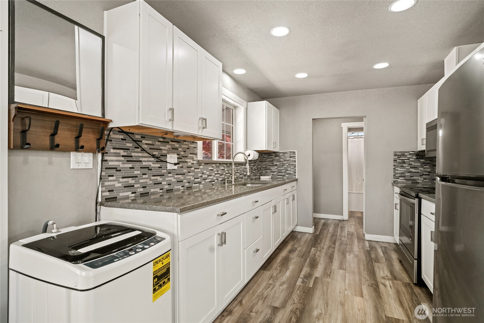 2440 Rock Island Road East Wenatchee, WA 98802 - Photo 8 of 37 a kitchen with granite countertop a sink stove and refrigerator