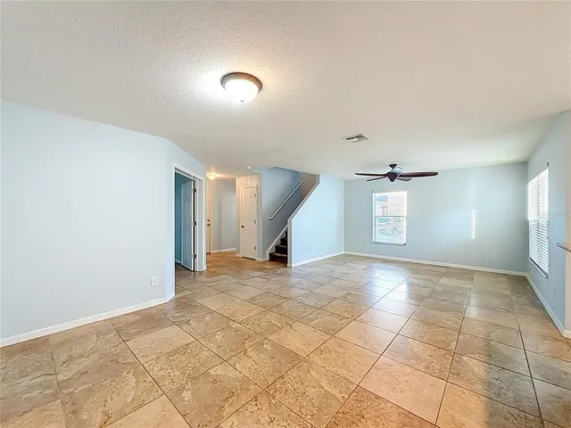 a bathroom with a toilet a sink a vanity and mirror