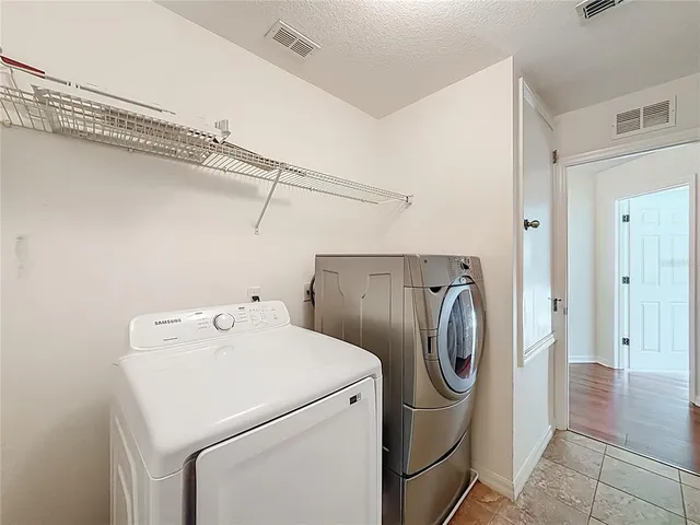 a view of a building with a yard