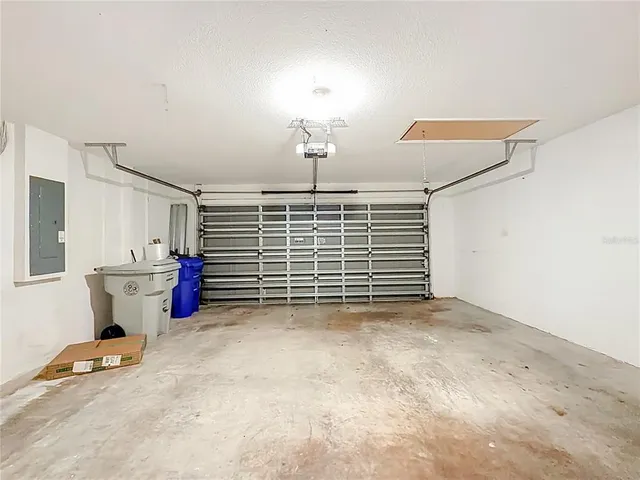 an aerial view of residential houses with outdoor space and river