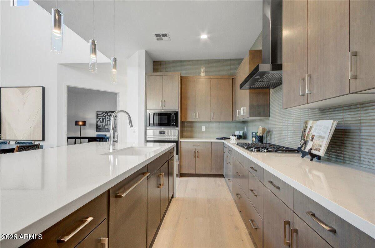 100 West Northern Avenue, Unit 6 Phoenix, AZ 85021 - Photo 5 of 26 a kitchen with a sink a stove and cabinets