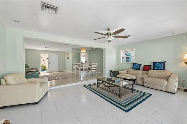 a living room with furniture and a table