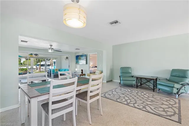 a dining room with furniture and window