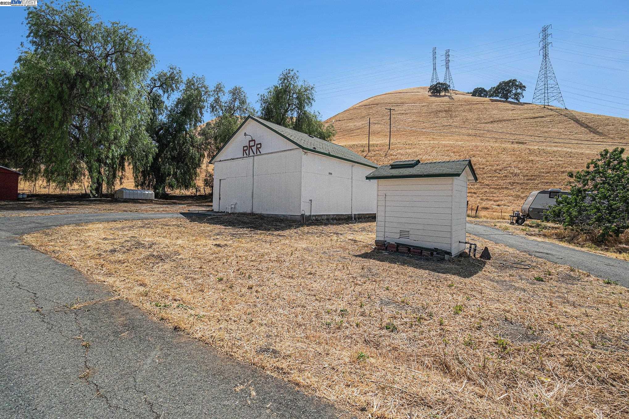 5799 Nortonville Road Pittsburg, CA 94565 - Photo 41 of 59 a view of a house with backyard and trees
