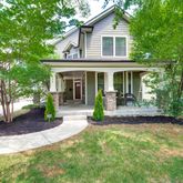 a view of a yard in front of house with a porch