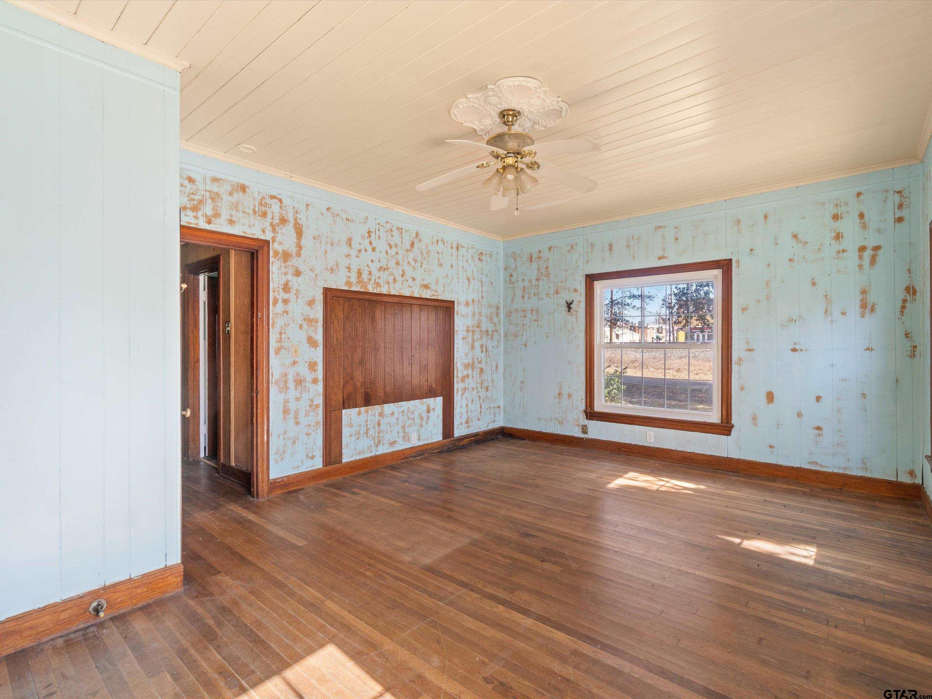 102 South Front Street Overton, TX 75684 - Photo 20 of 22 a view of an empty room with wooden floor