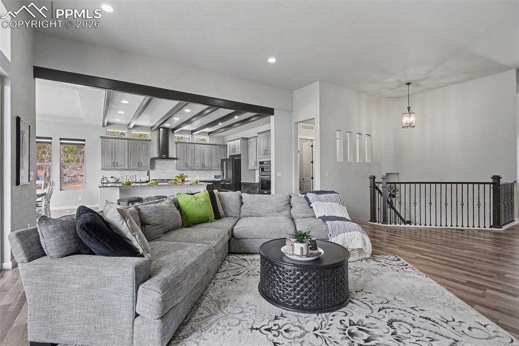 16474 Morning Rise Lane Monument, CO 80132 - Photo 17 of 49 a living room with furniture and a wooden floor