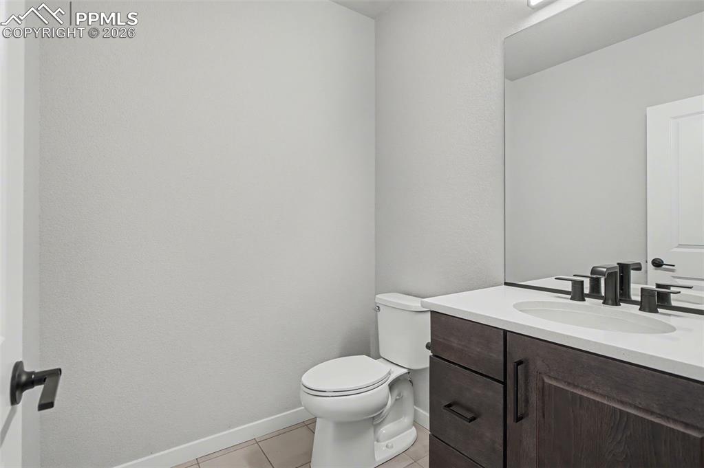 16474 Morning Rise Lane Monument, CO 80132 - Photo 23 of 49 a bathroom with a sink a toilet and mirror