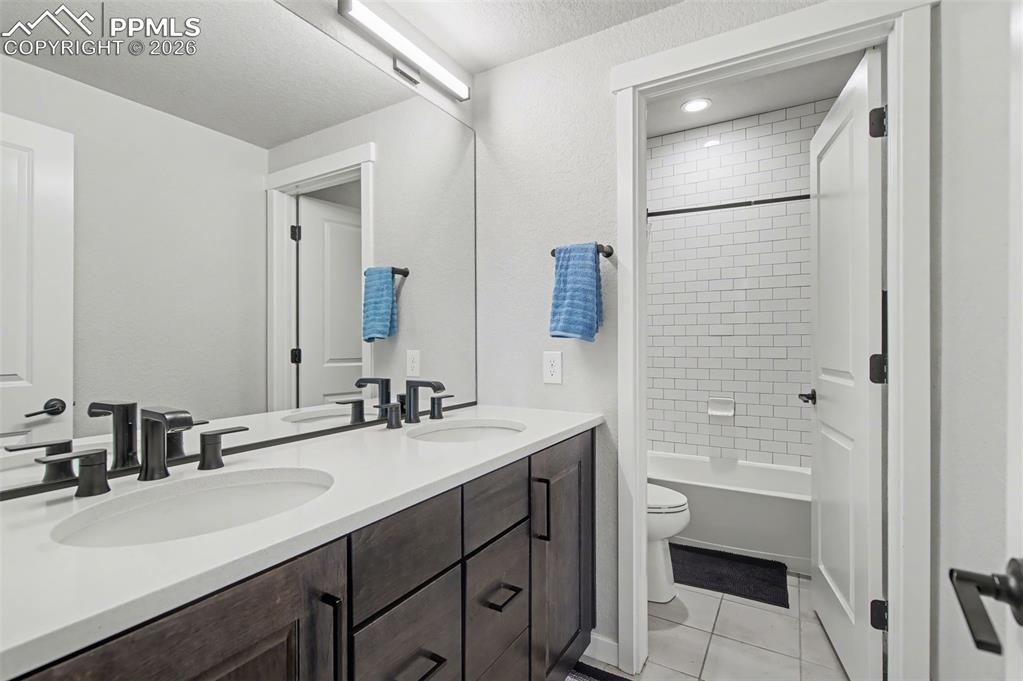 16474 Morning Rise Lane Monument, CO 80132 - Photo 36 of 49 a bathroom with a sink and a mirror