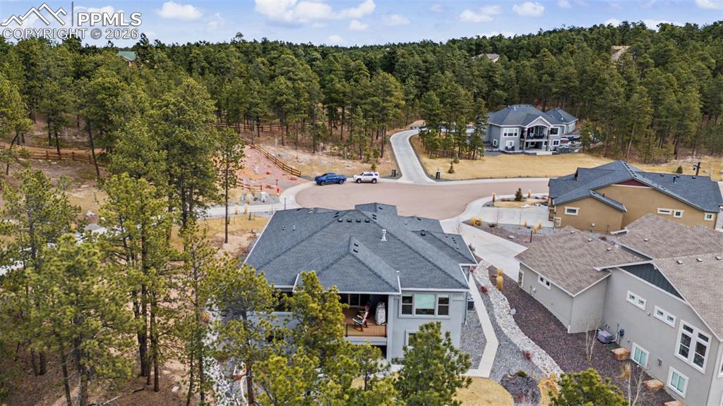 16474 Morning Rise Lane Monument, CO 80132 - Photo 6 of 49 an aerial view of a house with a garden and lake view