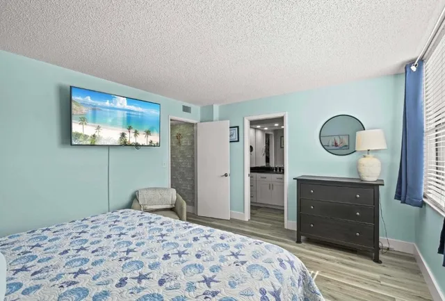 a bedroom with a bed and a dresser