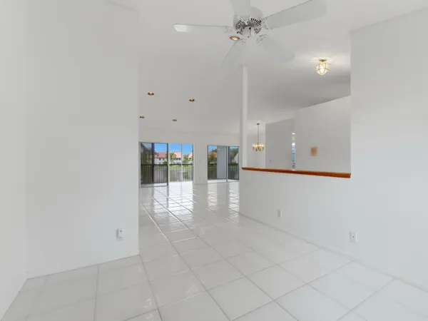 a kitchen with cabinets stainless steel appliances and a window