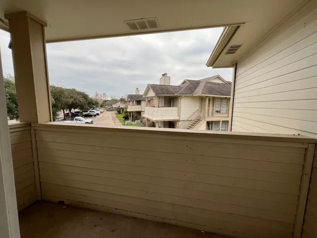 a view of a balcony with city view