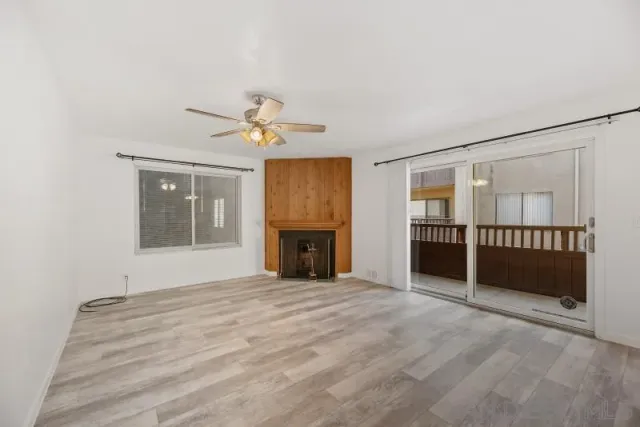 a view of an empty room with a fireplace