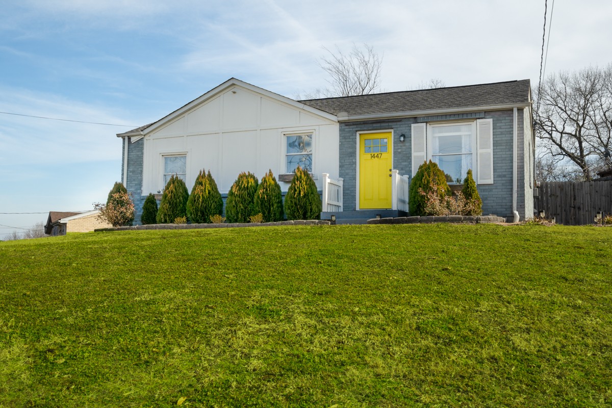 1447 Dolan Road Nashville, TN 37218 - Photo 1 of 20 a front view of a house with garden