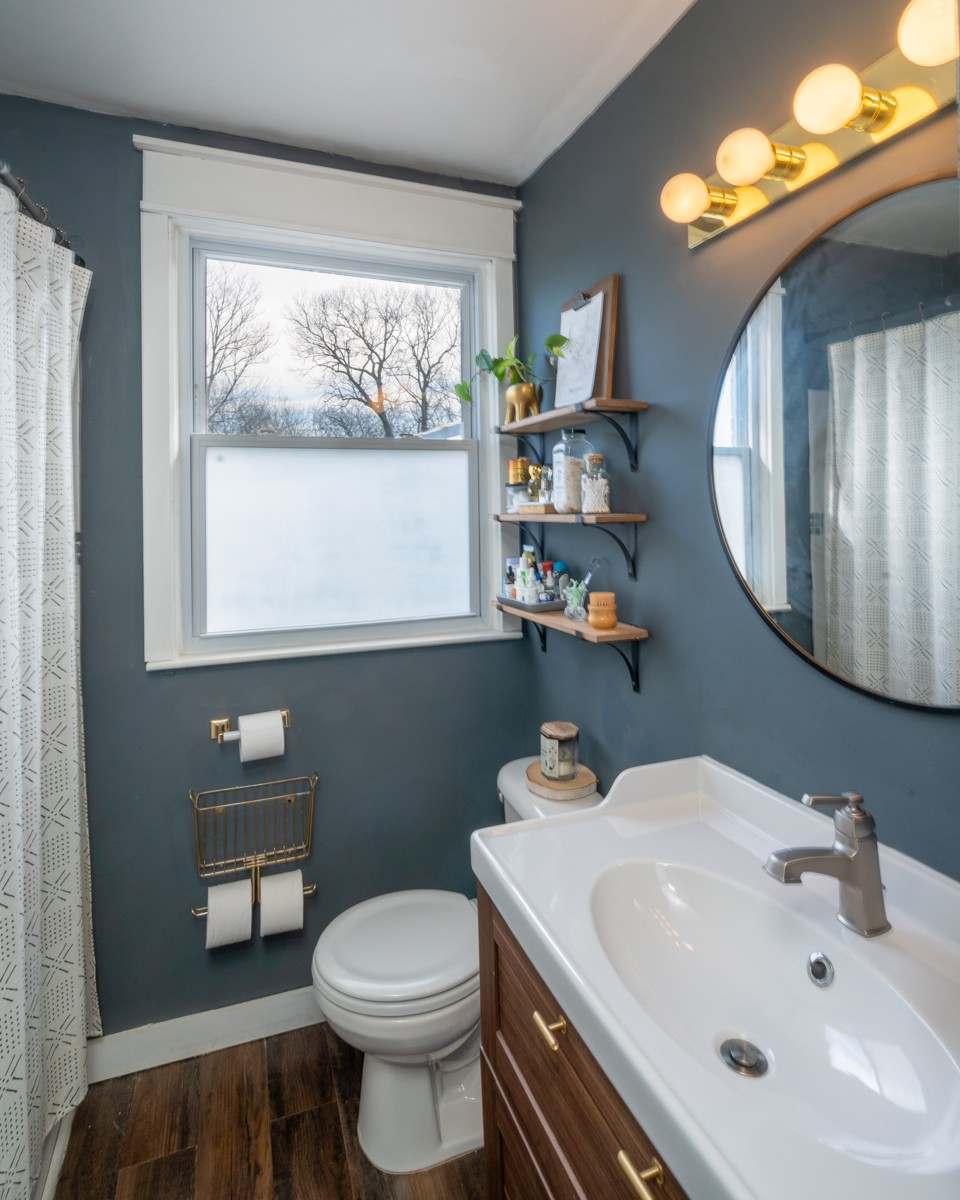 1447 Dolan Road Nashville, TN 37218 - Photo 14 of 20 a bathroom with a sink a toilet and a mirror