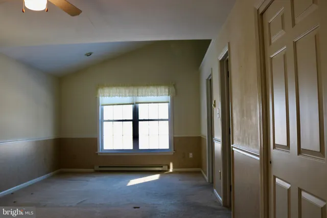 a view of empty room with windows