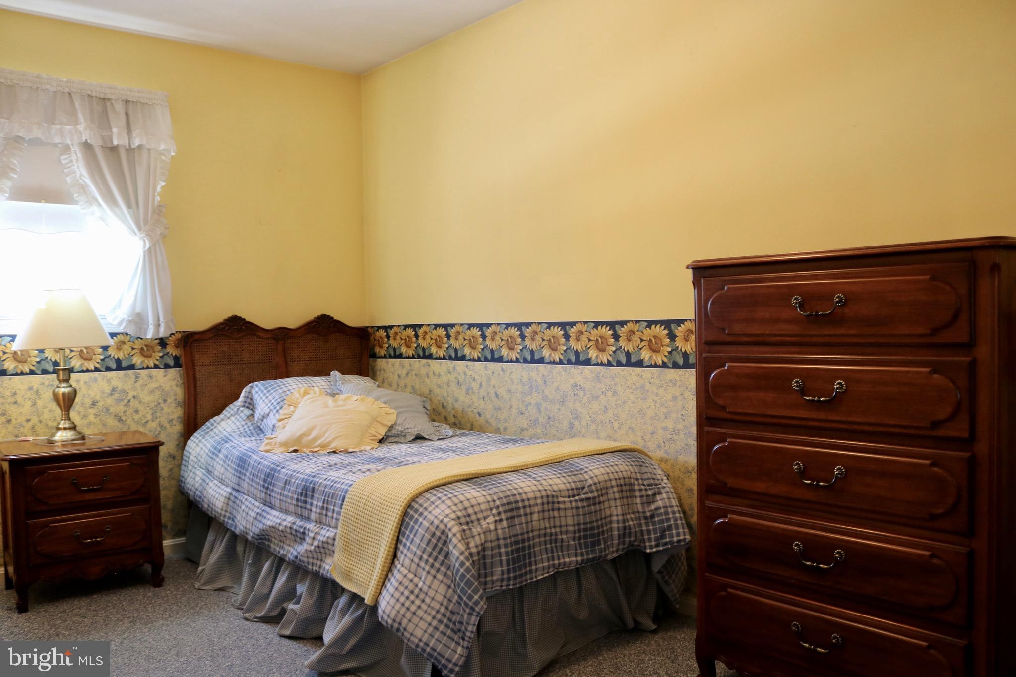 1386 Landisville Road Manheim, PA 17545 - Photo 18 of 26 a bedroom with a bed and a mirror