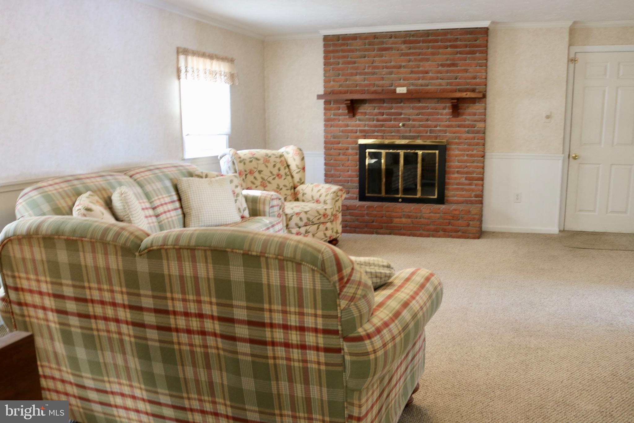 1386 Landisville Road Manheim, PA 17545 - Photo 19 of 26 a living room with furniture and a fireplace