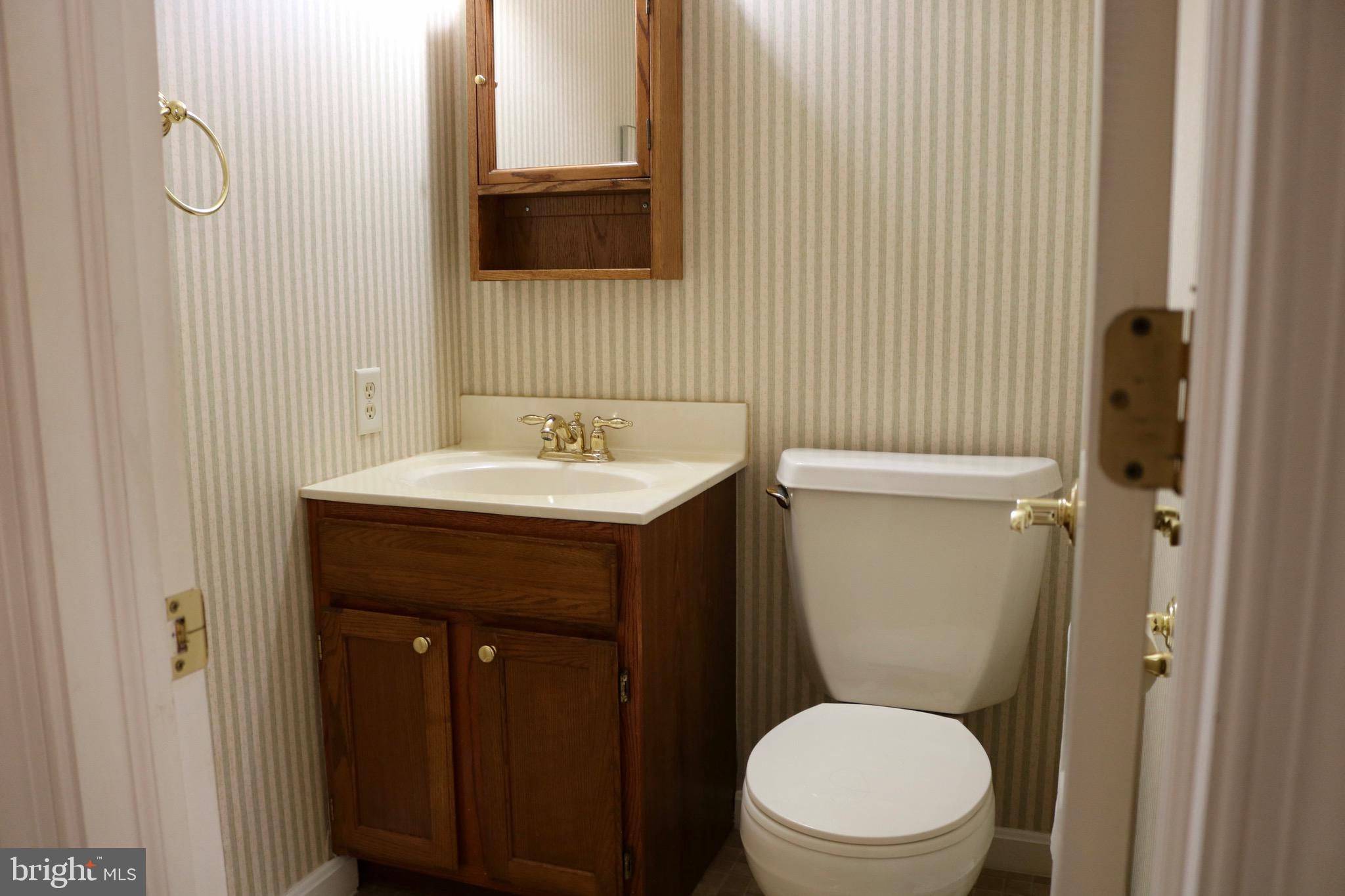 1386 Landisville Road Manheim, PA 17545 - Photo 23 of 26 a bathroom with a toilet a sink and mirror