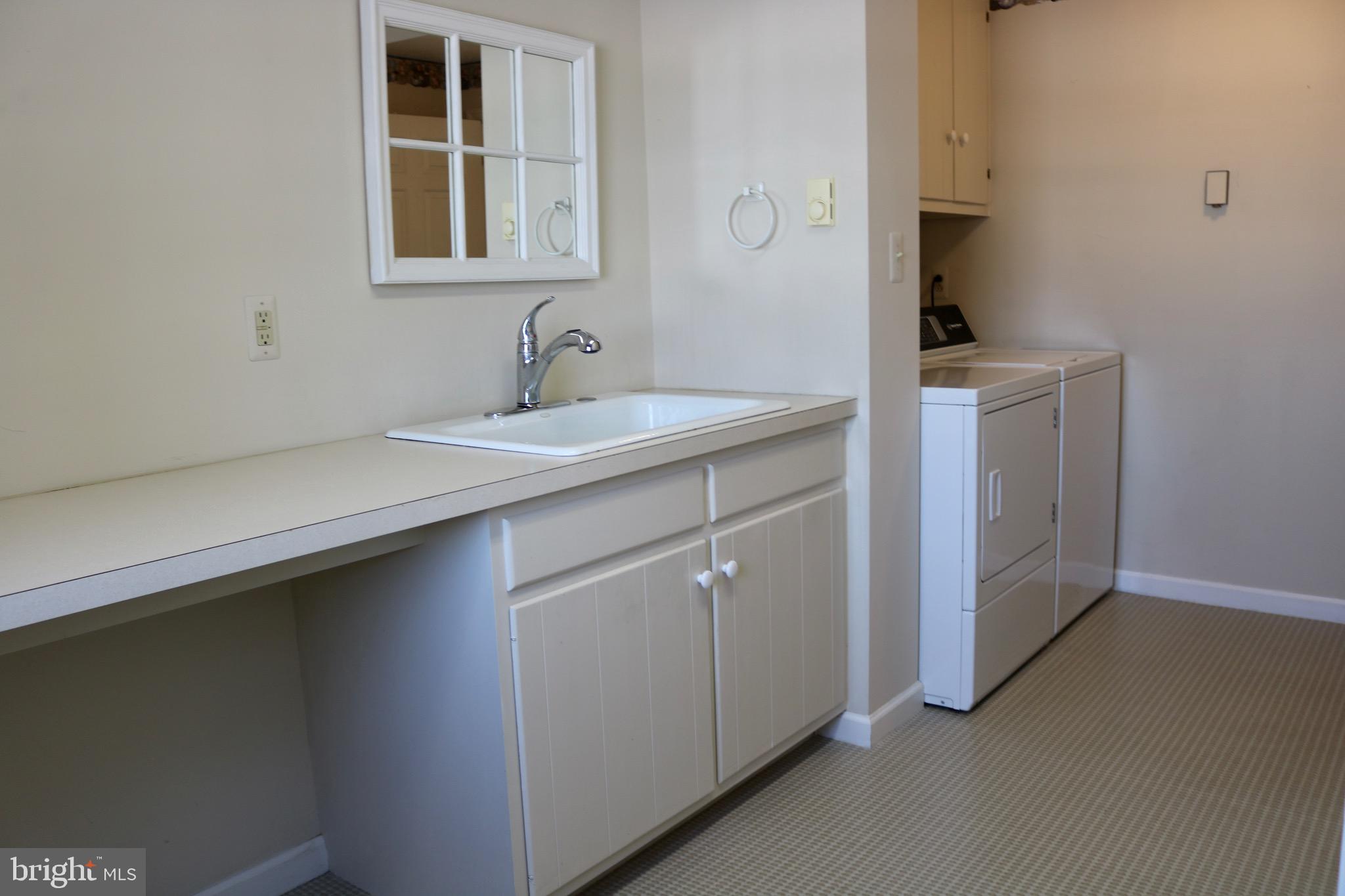 1386 Landisville Road Manheim, PA 17545 - Photo 25 of 26 a utility room with cabinets washer and dryer