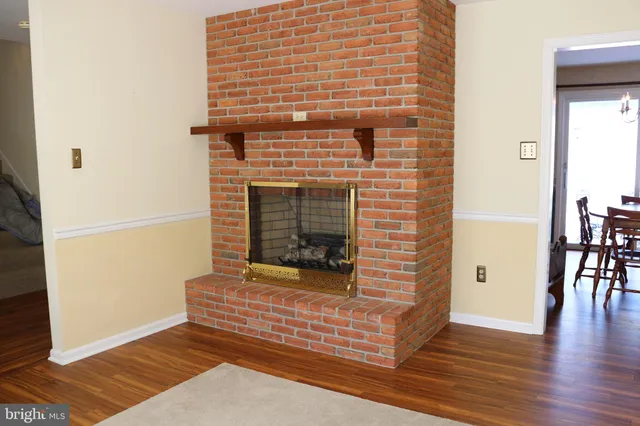 a view of a livingroom with wooden floor