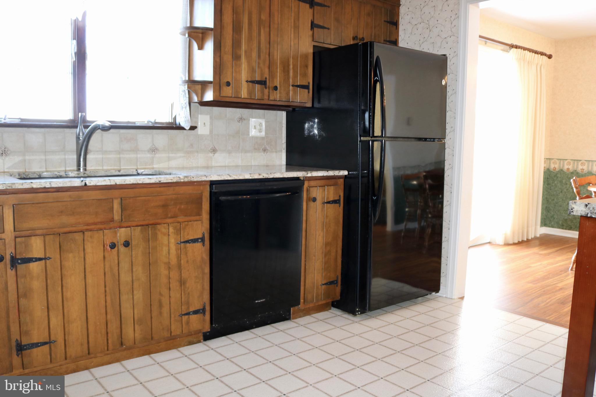 1386 Landisville Road Manheim, PA 17545 - Photo 8 of 26 a kitchen with a refrigerator and a sink