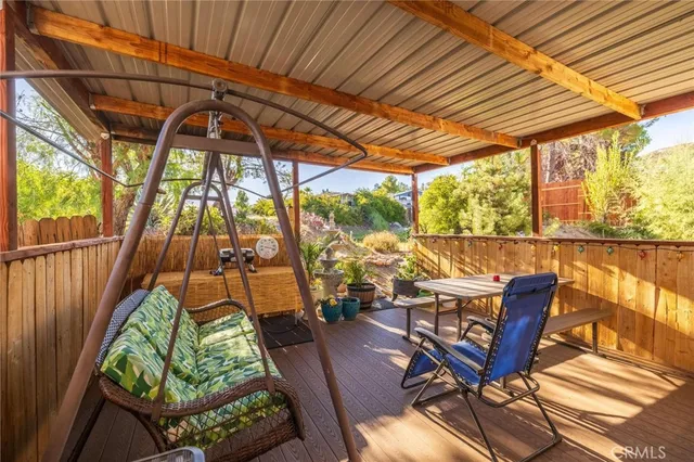 a view of a balcony with furniture