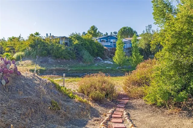 a view of a yard with an outdoor space