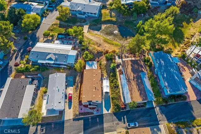 a view of a house with a tree and a yard