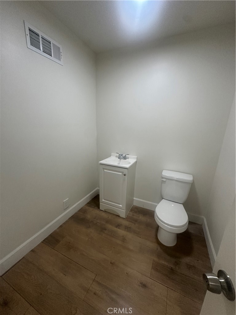 815 South Main Street Corona, CA 92882 - Photo 17 of 24 a white toilet sitting next to a white sink