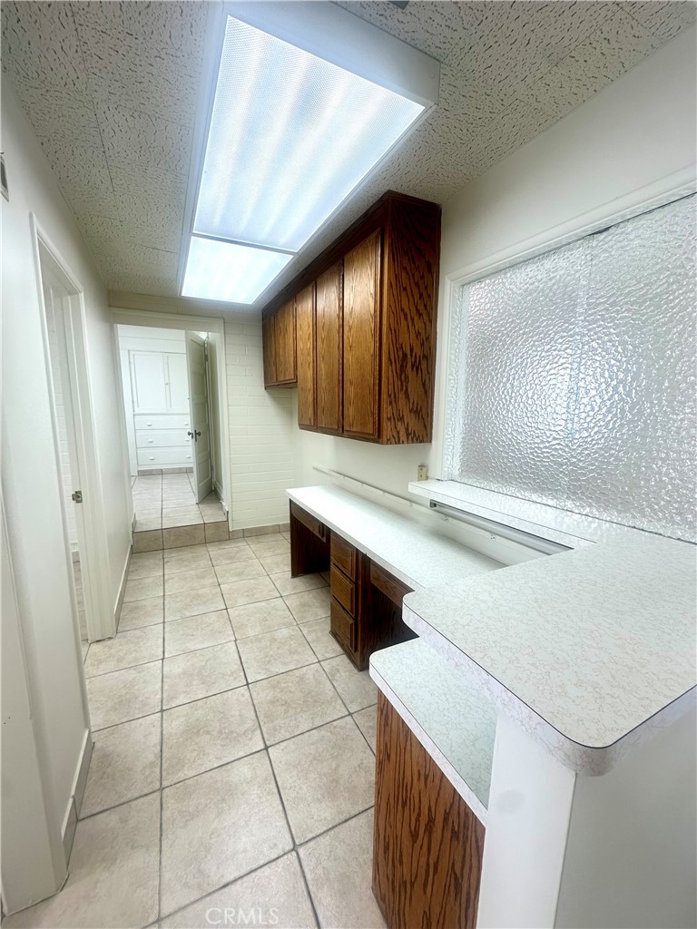 815 South Main Street Corona, CA 92882 - Photo 21 of 24 a bathroom with a sink and a mirror