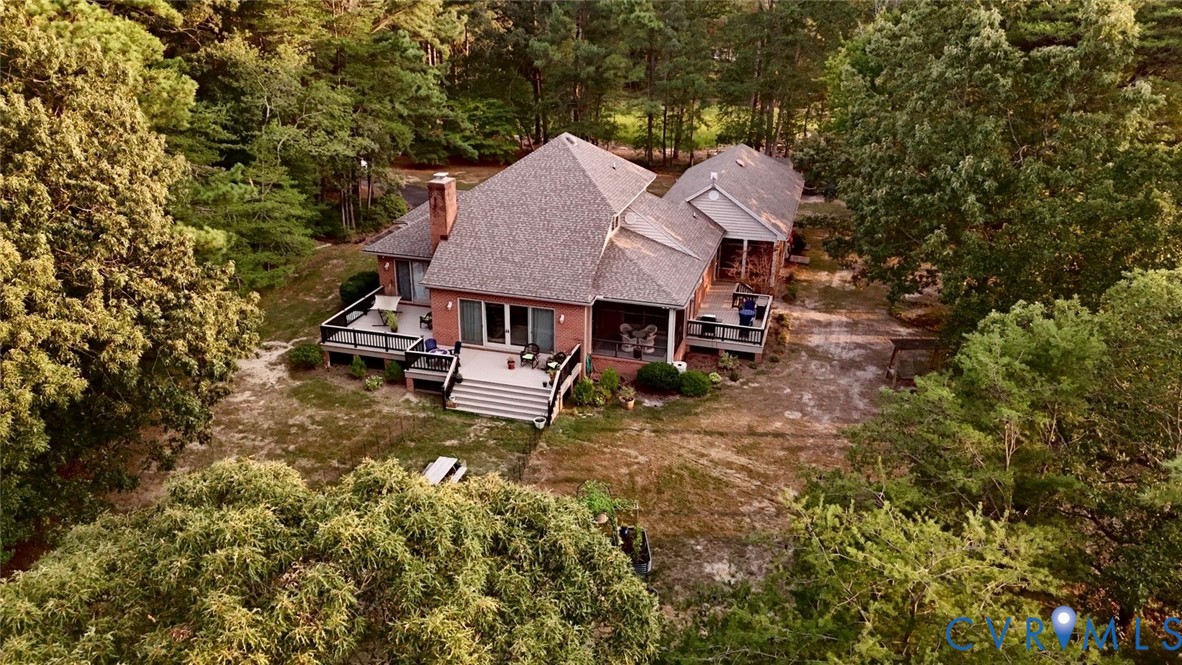 Brick exterior residence with multi-level decks, m
