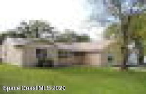 858 Cochran Road Southeast Palm Bay, FL 32909 - Photo 1 of 1 a view of a building with a yard