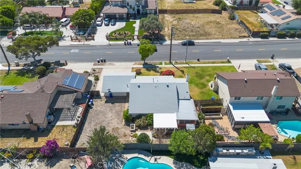 an aerial view of a house with a swimming pool