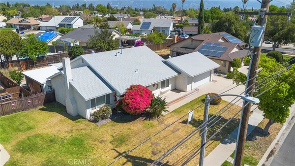 an aerial view of a house with a garden