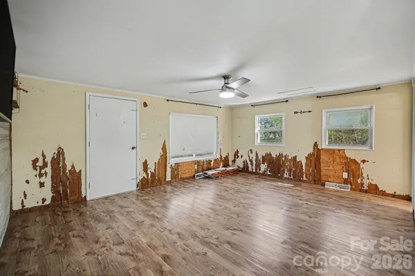 a view of a room with gym equipment and a window