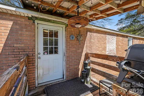 a view of house with stairs and wooden floor