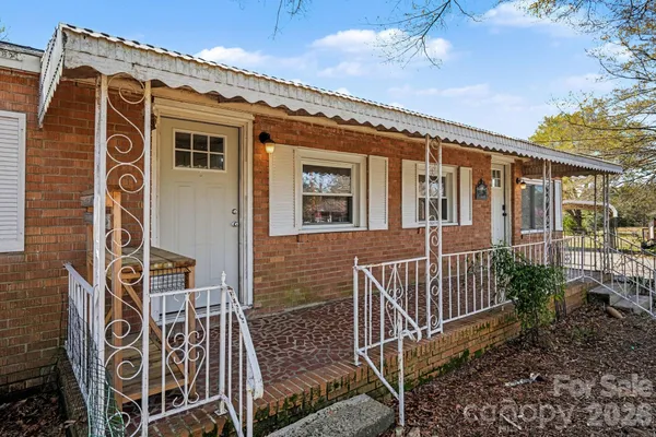a front view of a house with stairs