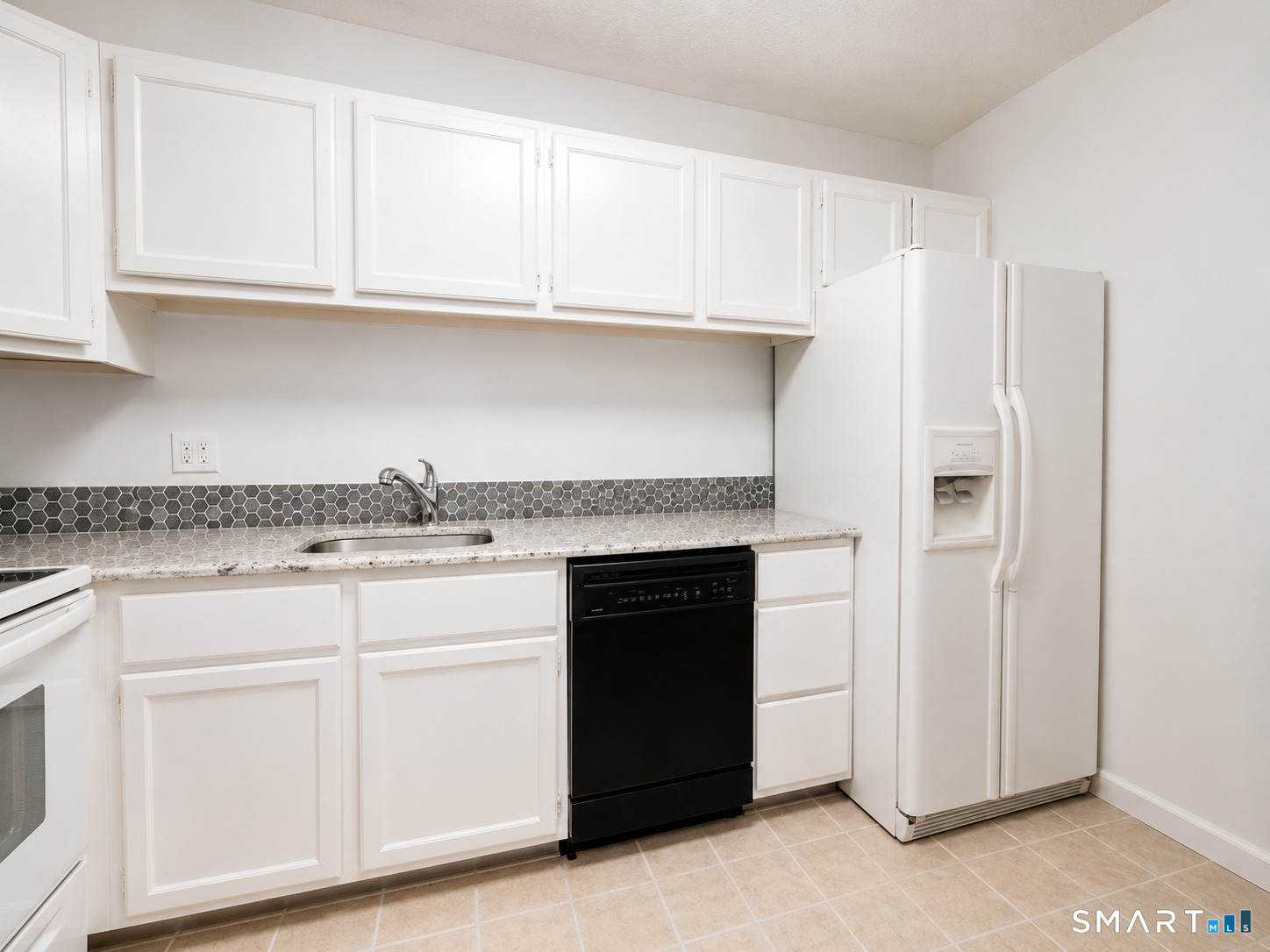 914 High Path Road, Unit 914 Windsor, CT 06095 - Photo 5 of 23 a kitchen with granite countertop white cabinets and a sink