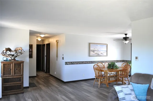 a view of a dining room with furniture and wooden floor