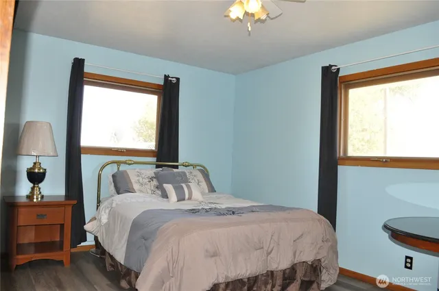 a bedroom with a large bed and a window