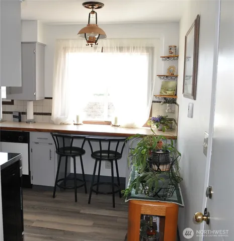 a kitchen with stainless steel appliances granite countertop a stove and a refrigerator