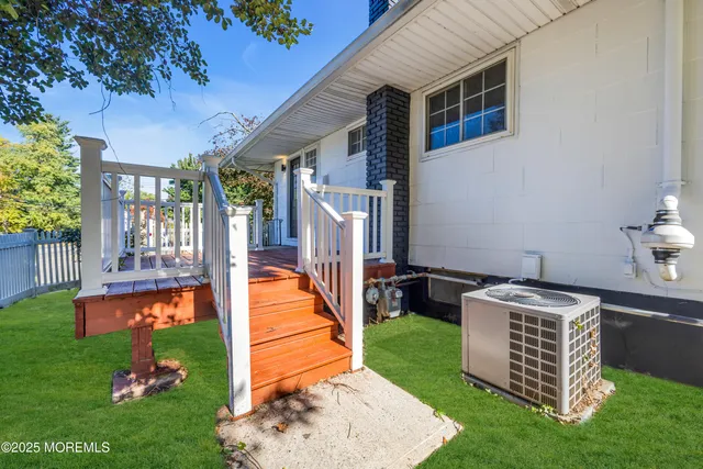 a balcony with table and chairs