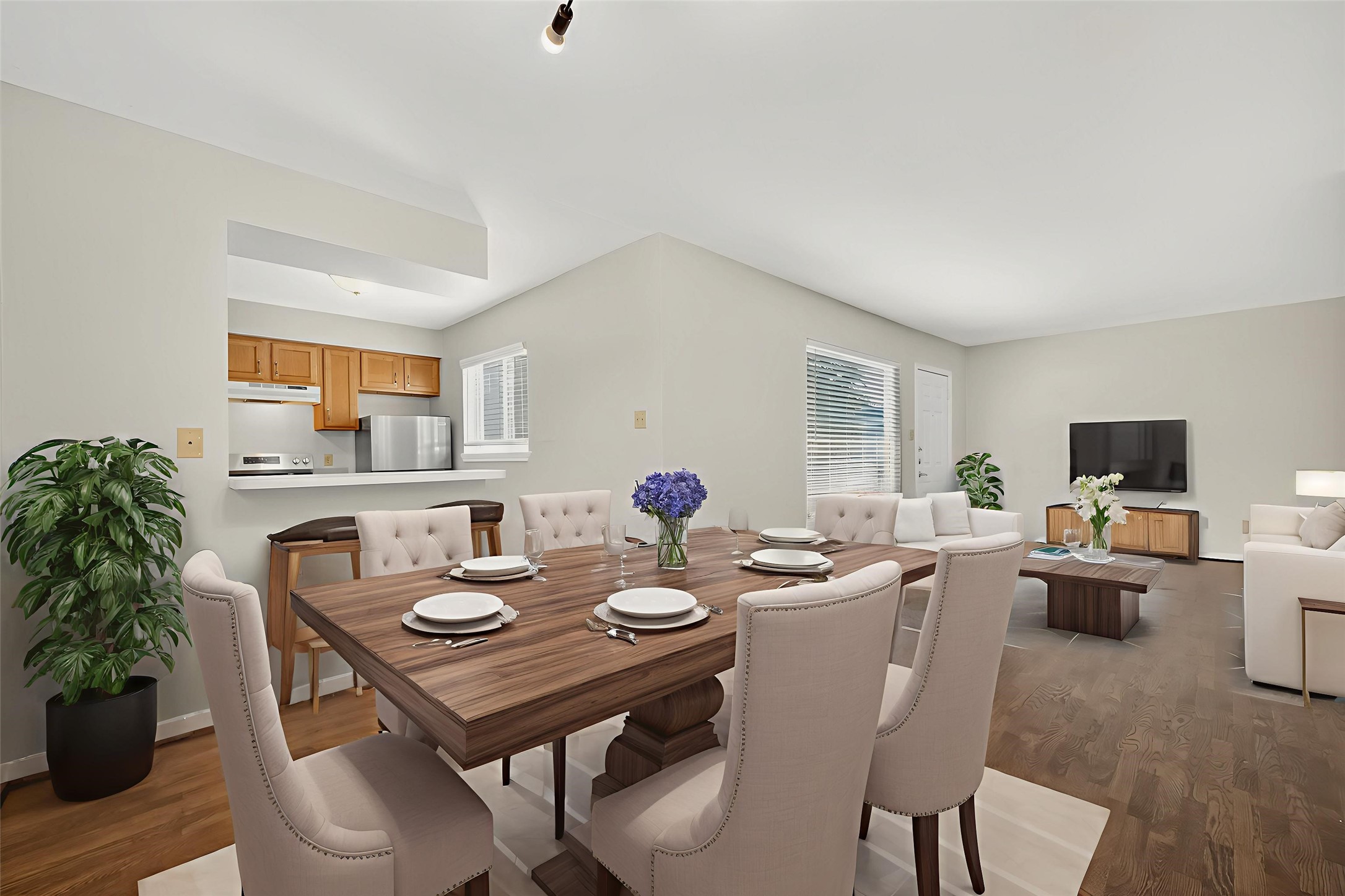 a view of a dining room with furniture and wooden floor