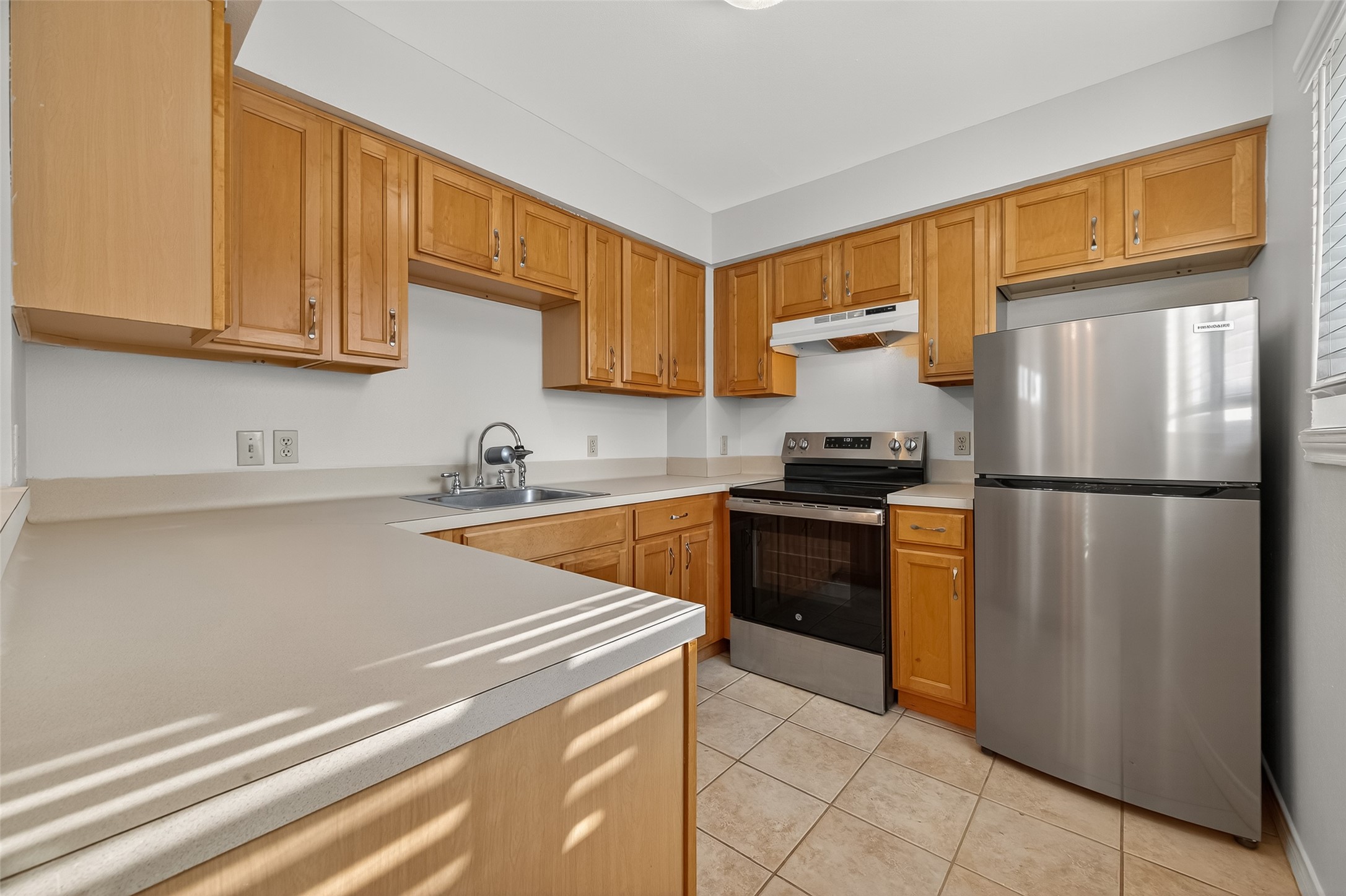 2020 Huldy Street, Unit 10 Houston, TX 77019 - Photo 14 of 24 a kitchen with a refrigerator sink and cabinets